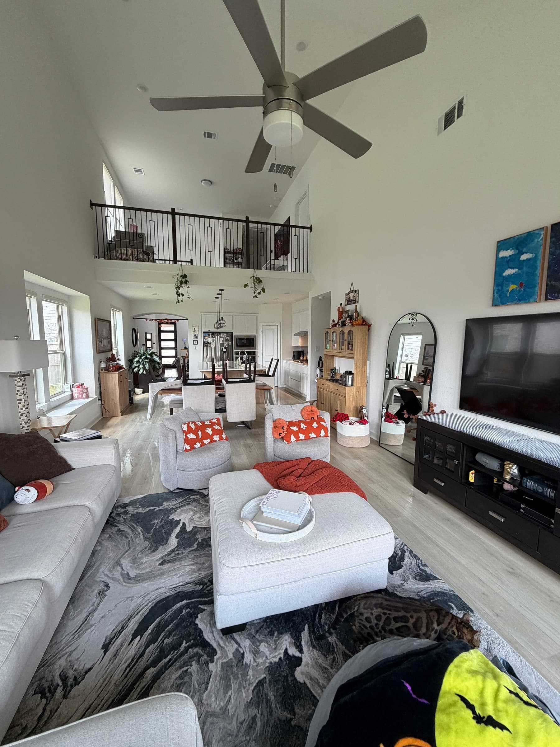 Two-story living room and kitchen in a Gen 2 Cleaners client's home